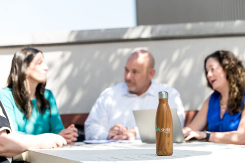 The Wilshire Group revenue cycle consulting team meeting outside